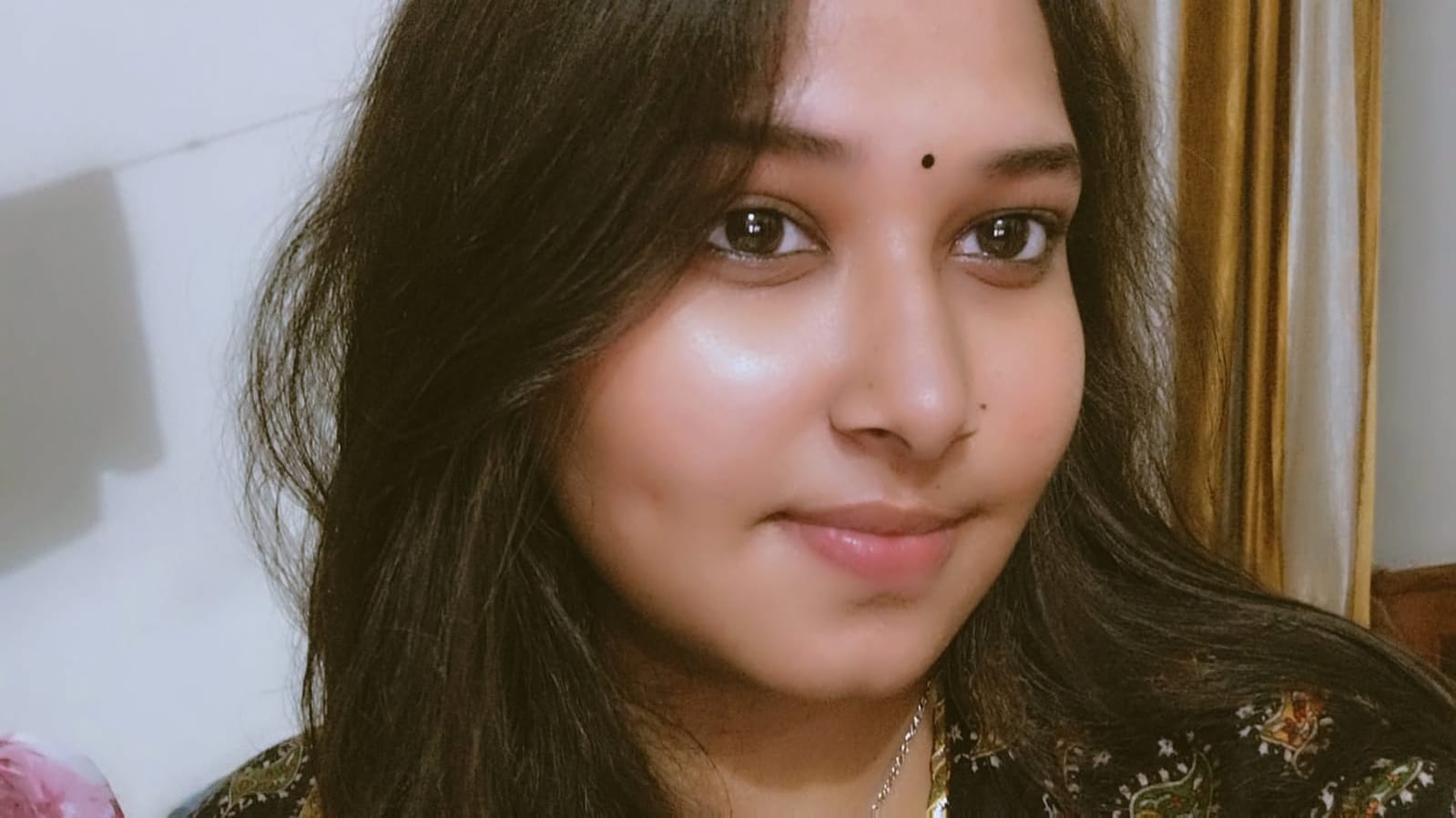Laxmiii smiling softly